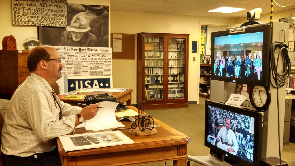 Photo of Man at desk distance learning.